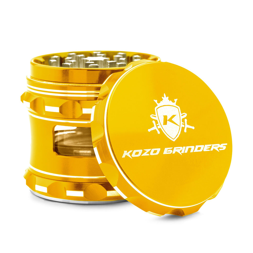 Kozo 2.5 inch window grinder in gold, side viewing window with the lid tilted open to show the teeth