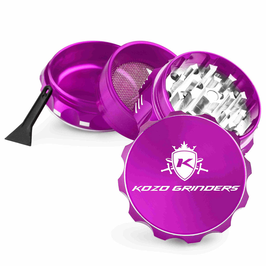 Kozo 2 inch four-piece aluminum grinder in purple, split into four pieces with the pollen scraper