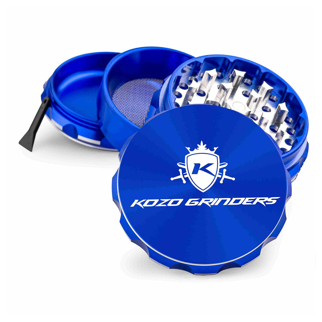 Kozo 3 inch four-piece anodized aluminum grinder in blue, split into four pieces with the pollen scraper