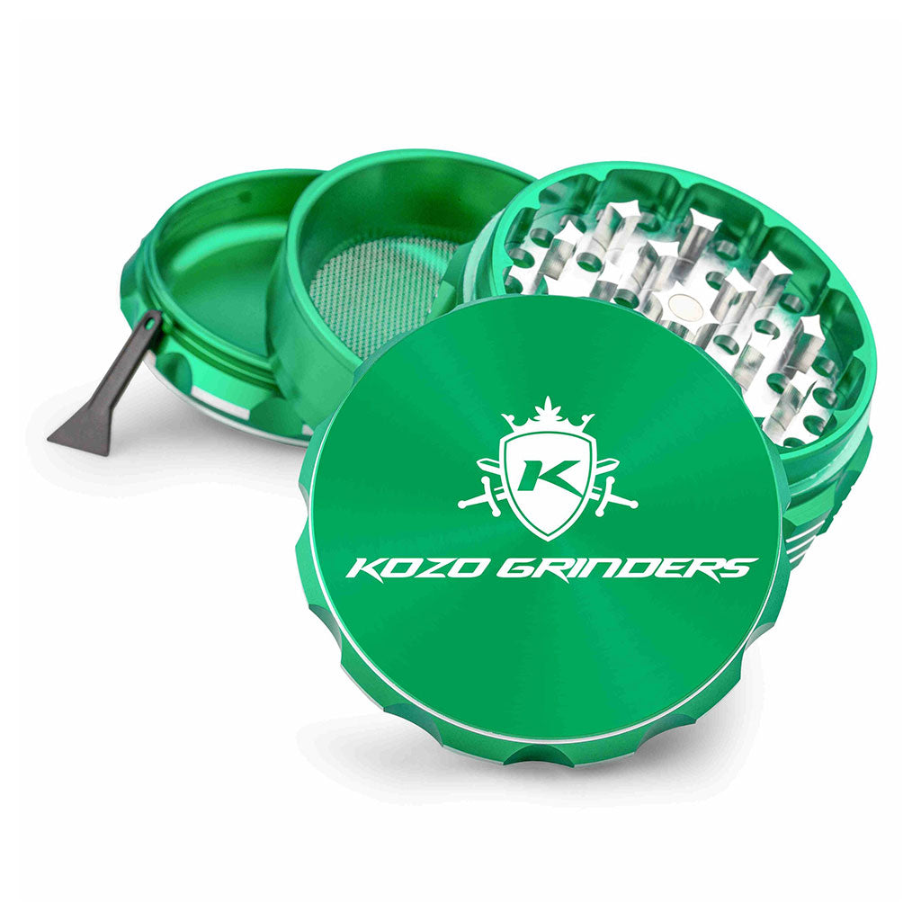 Kozo 3 inch four-piece anodized aluminum grinder in green, split into four pieces with the pollen scraper