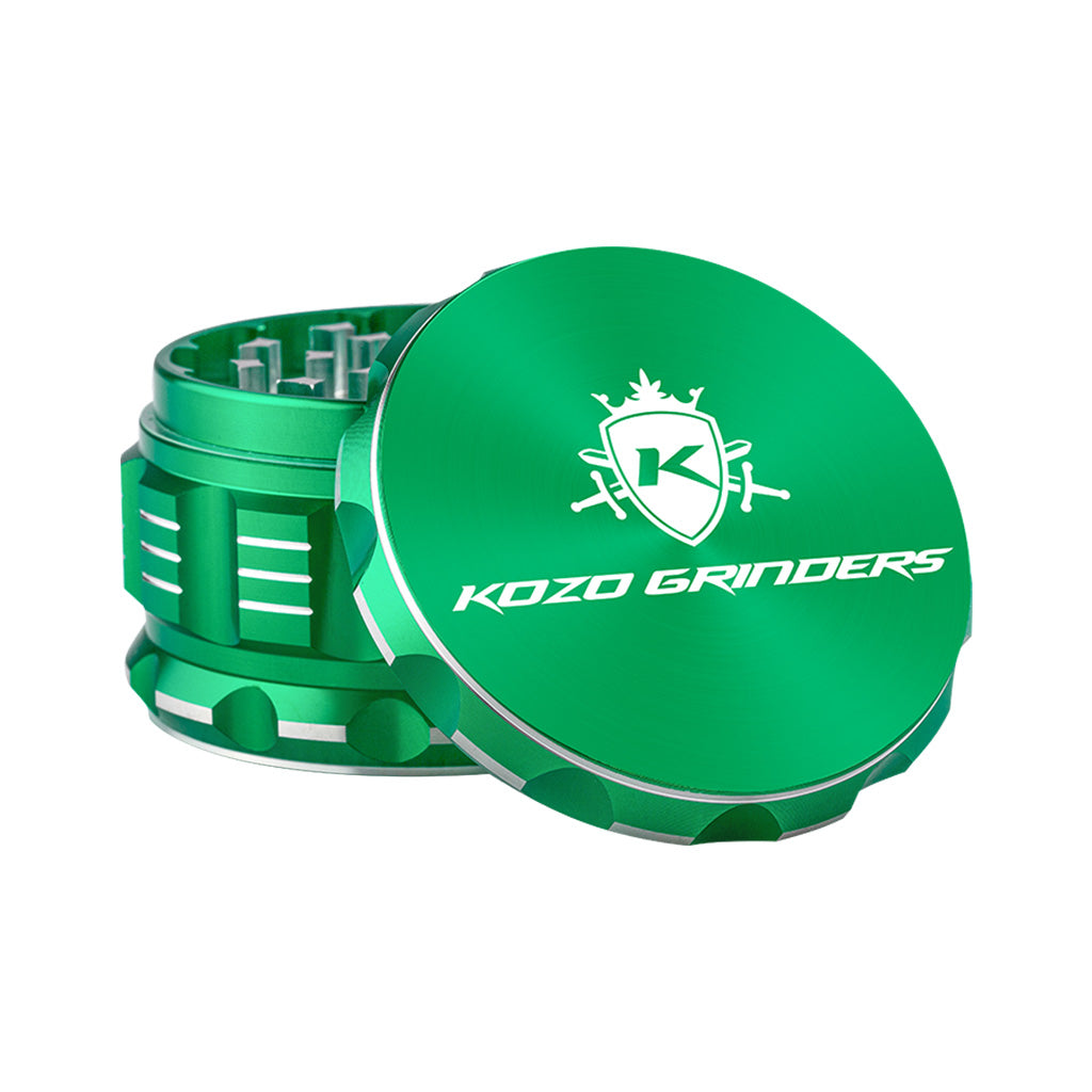 Kozo 3 inch four-piece anodized aluminum grinder in green, lid tilted open beside the toothed grinding chamber