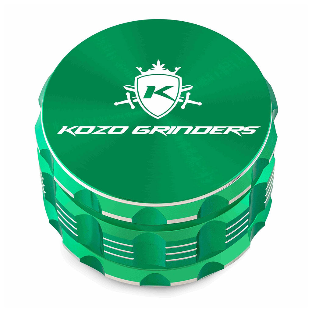 Kozo 3 inch four-piece anodized aluminum grinder in green, closed front view of the body with the Kozo logo lid