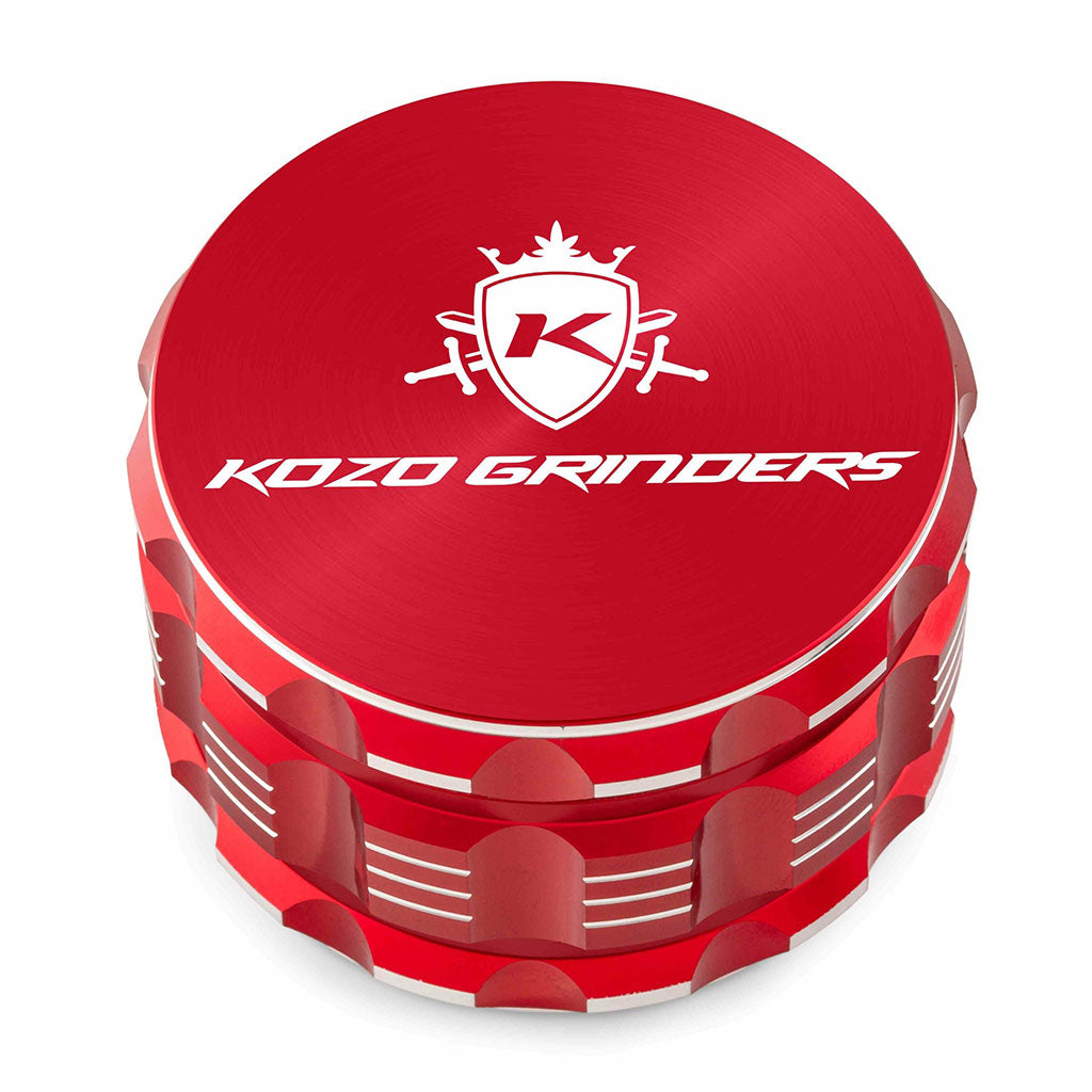 Kozo 3 inch four-piece anodized aluminum grinder in red, closed front view of the body with the Kozo logo lid