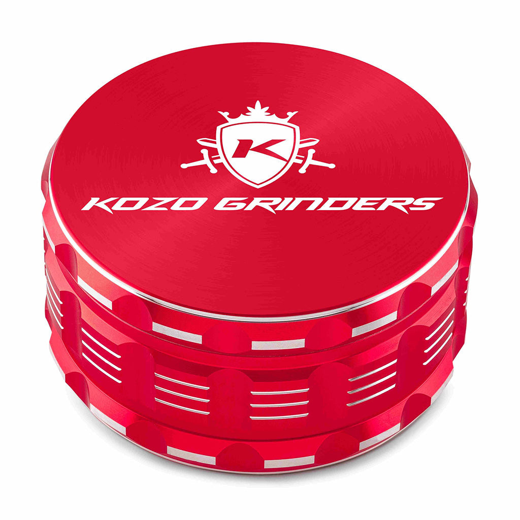 Kozo 4 inch four-piece anodized aluminum grinder in red, closed front view of the body with the Kozo logo lid