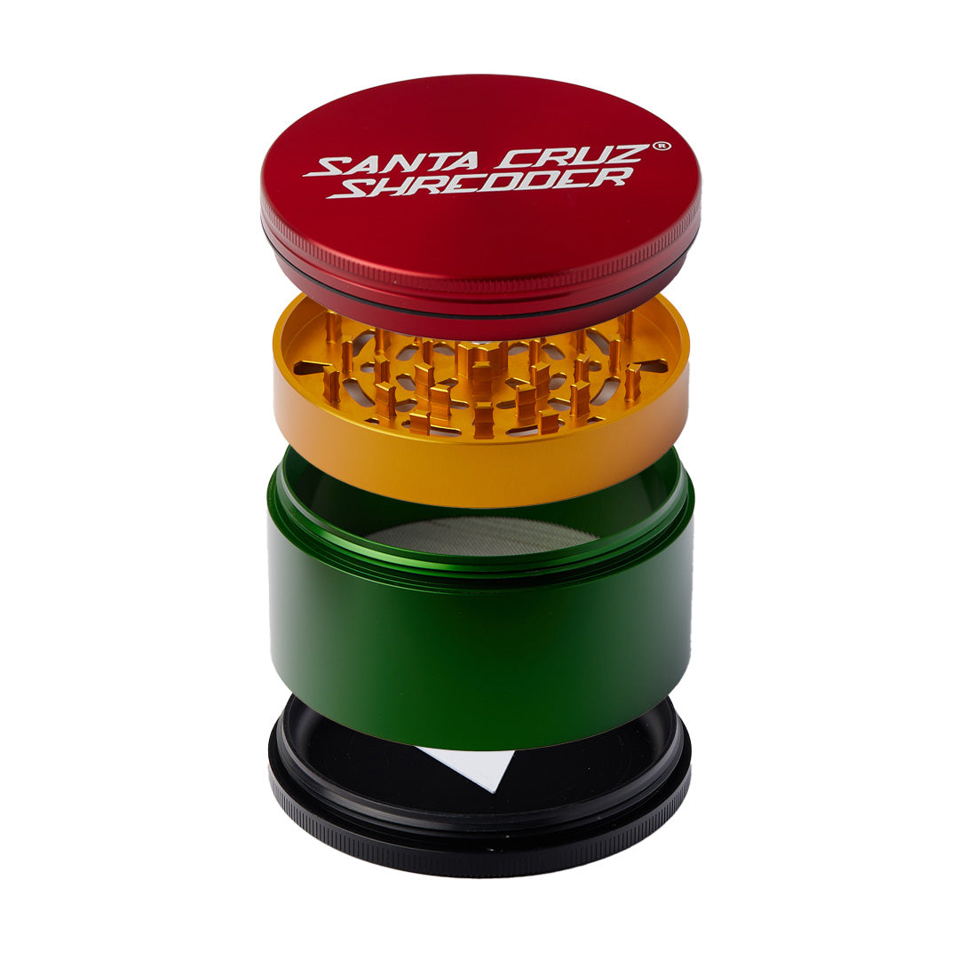 Santa Cruz Shredder Large 4 Piece Grinder in Rasta colors, compact design, ideal for dry herbs