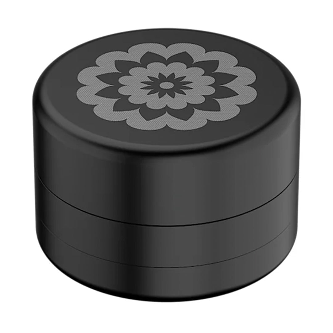 Flower Mill 2" Next Gen Standard Grinder in Black - Top View with Detailed Flower Design