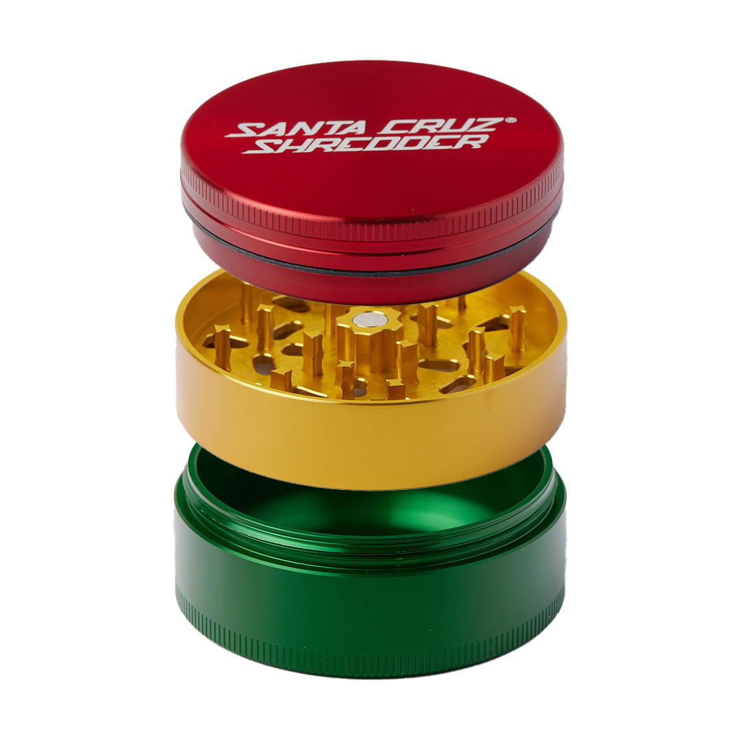 Santa Cruz Shredder Large 3-Piece Grinder in Rasta colors, front view, for dry herbs