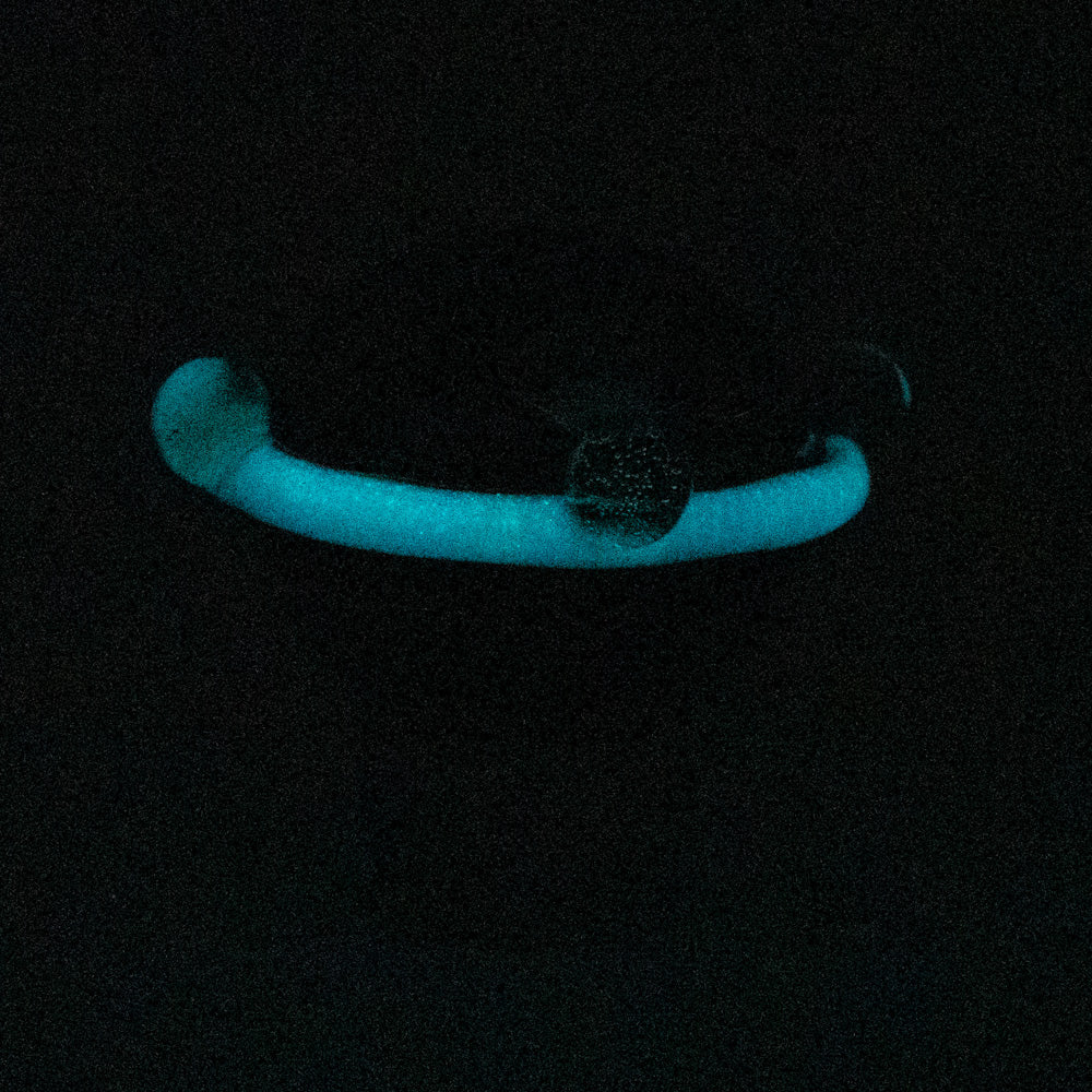 Empire Glassworks Galactic Spinner Cap glowing in dark, top view, for dab rigs