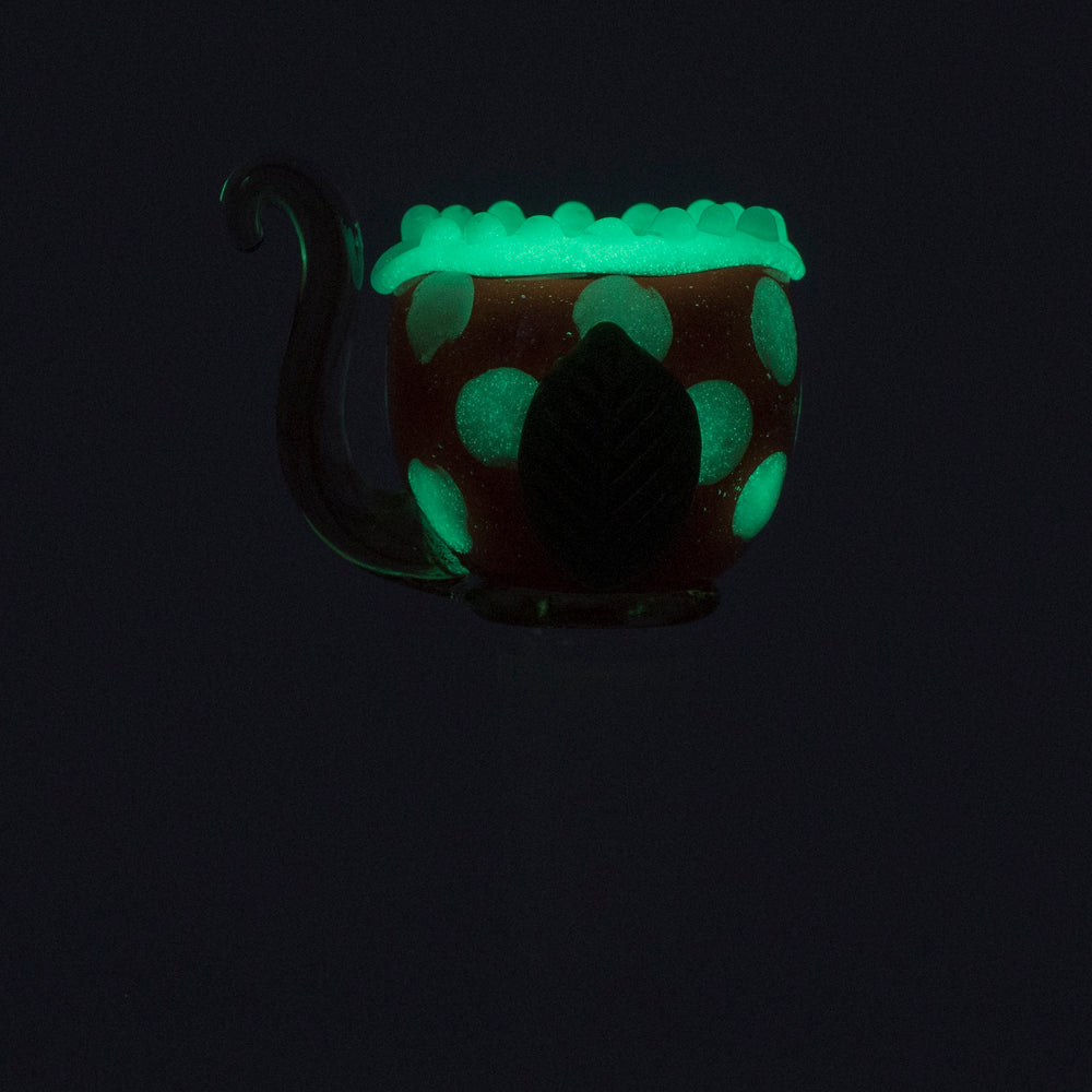 Empire Glassworks Fire Plant Bowl Piece glowing in dark, Borosilicate handpipe, side view