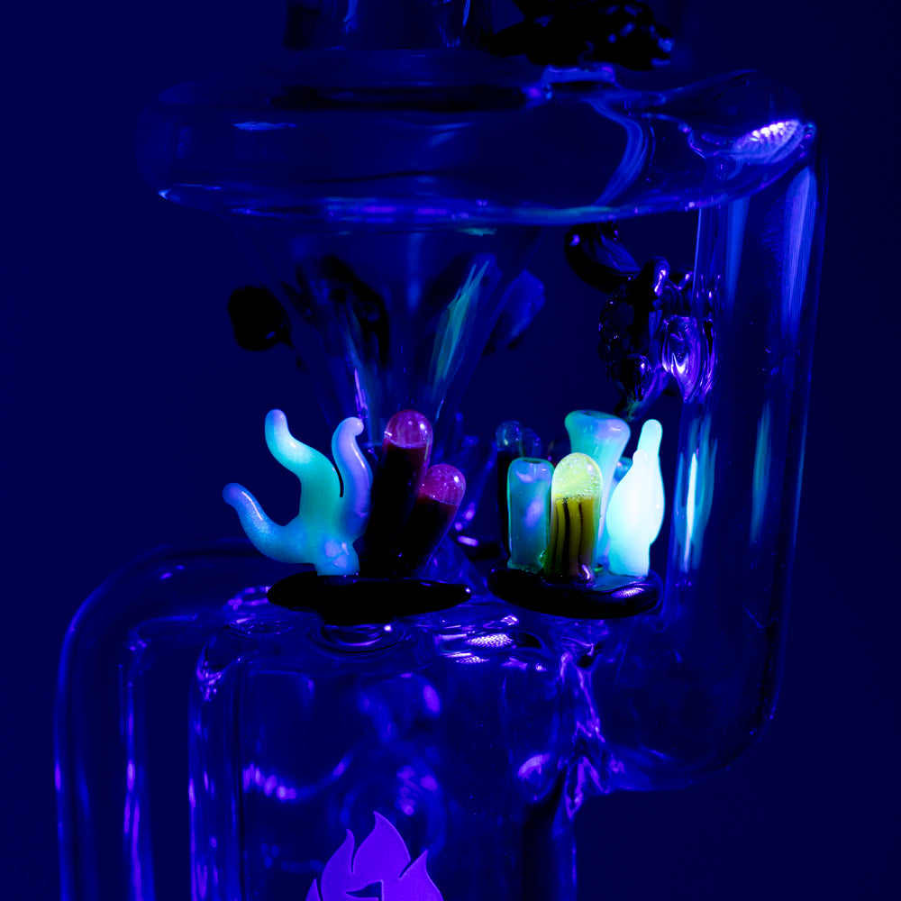 Empire Glassworks Recycler Dab Rig with Under The Sea theme glowing under black light