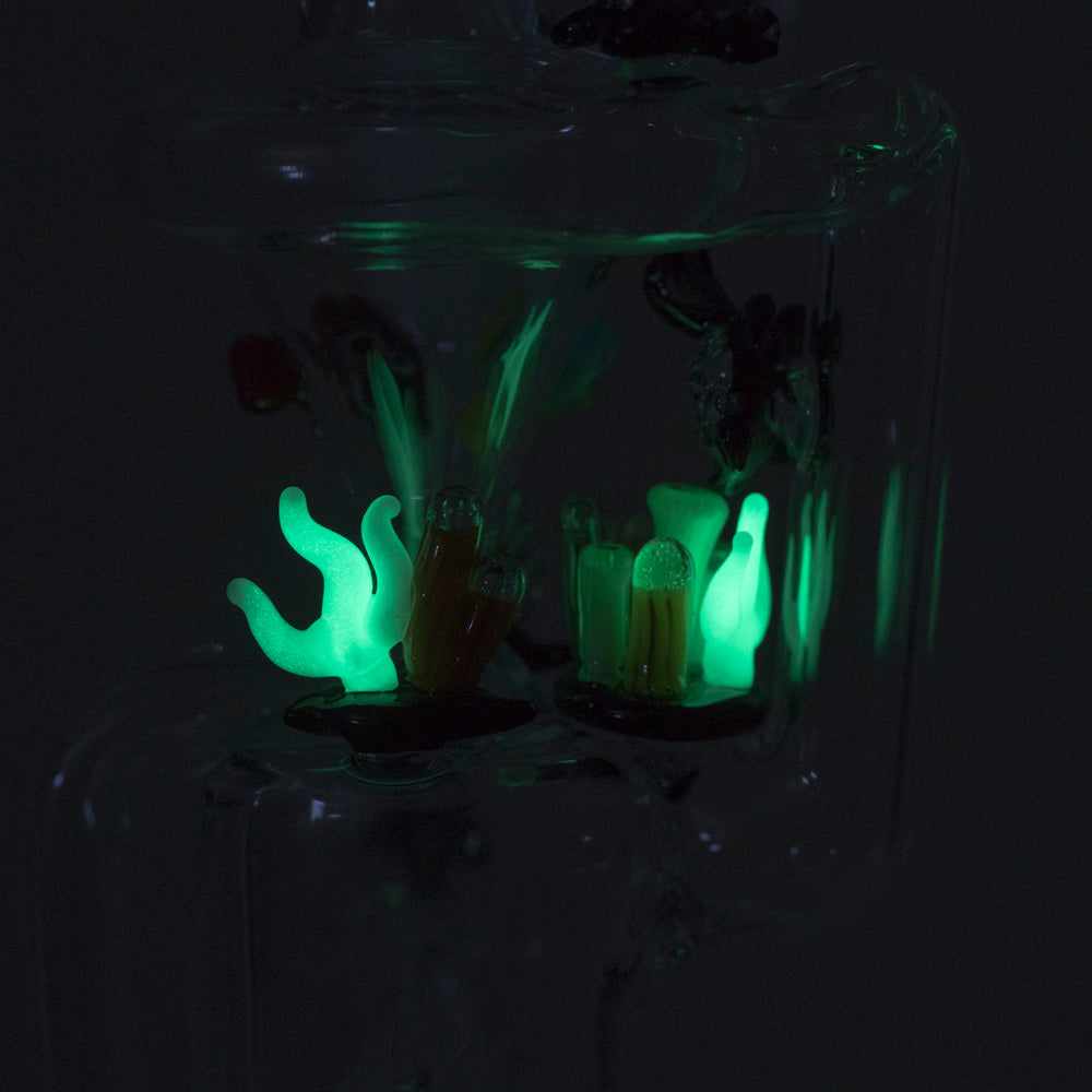 Empire Glassworks Recycler Dab Rig glowing in the dark, Under The Sea theme, close-up