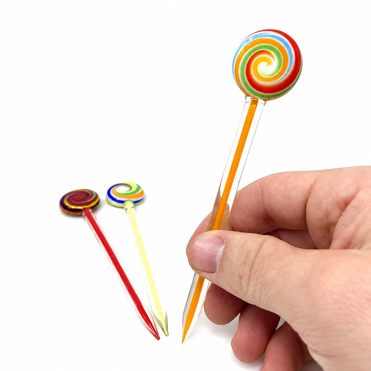 AFM Lolly Pop Glass Dabber Tool with colorful swirl design held in hand, clear background