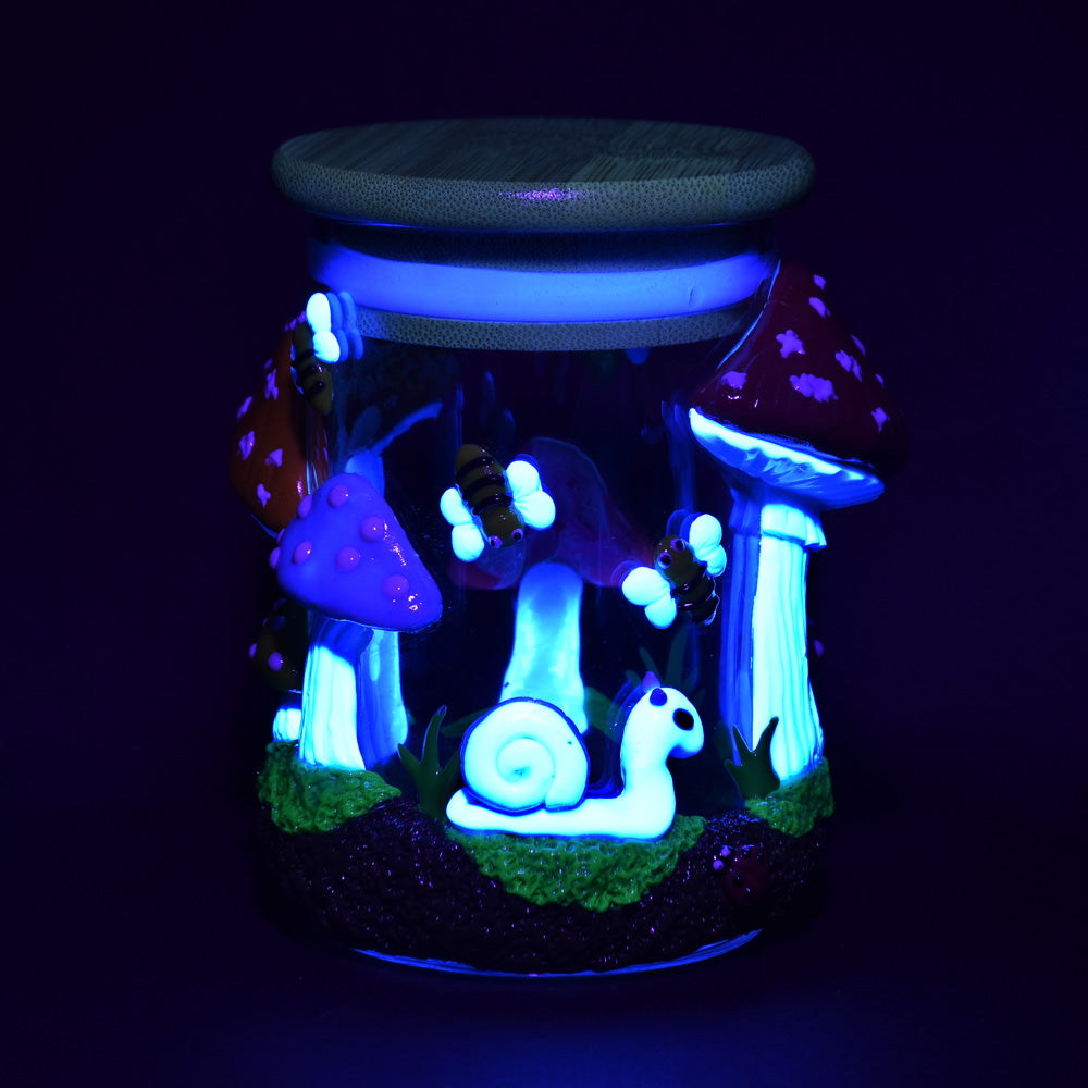 Pulsar Shrooms In The Wild Glass Jar glowing in the dark, front view, 4.25" size, with detailed mushroom art