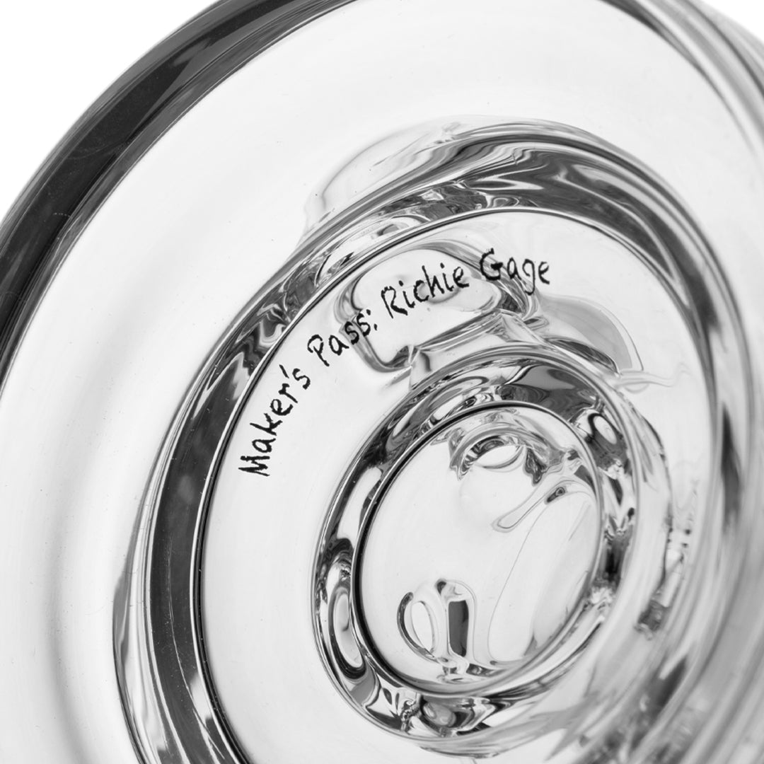 Close-up of MJ Arsenal Plasma Core Rig showing the intricate glasswork and maker's mark