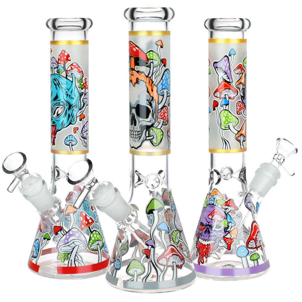 Monsters And Shrooms Glow Glass Beaker Water Pipes with various vibrant designs, 10" height, 14mm female joint