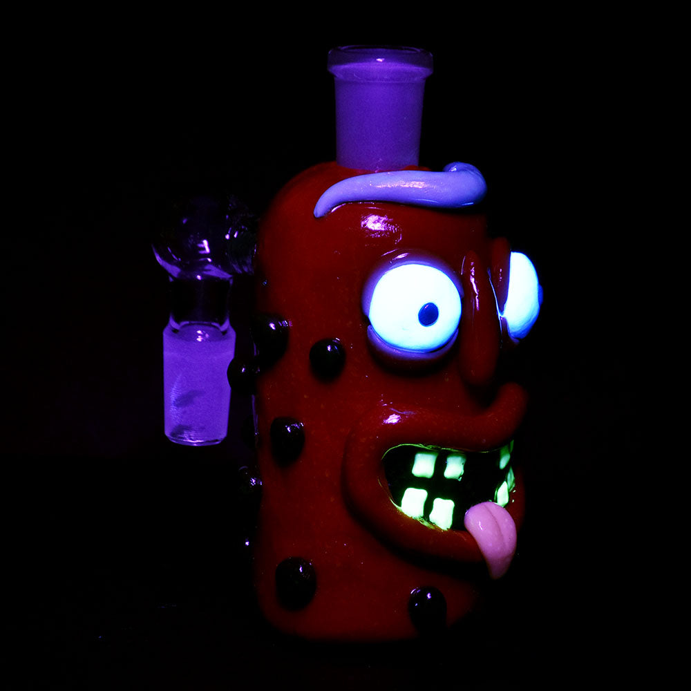Mr Pickle Glass & Enamel Glow Ash Catcher with 14mm joint, 90-degree angle, front view in dark