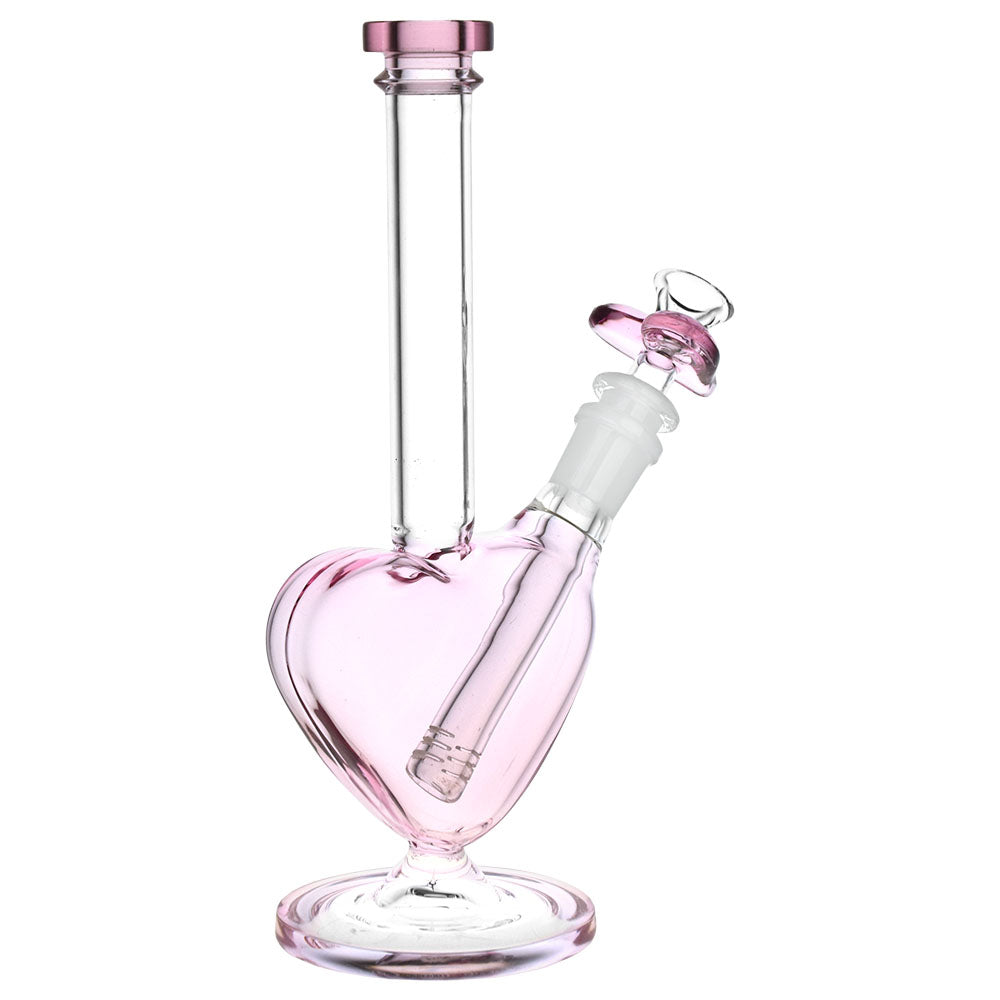 Heart-shaped pink glass water pipe with a 14mm female joint and heavy wall, front view on white background