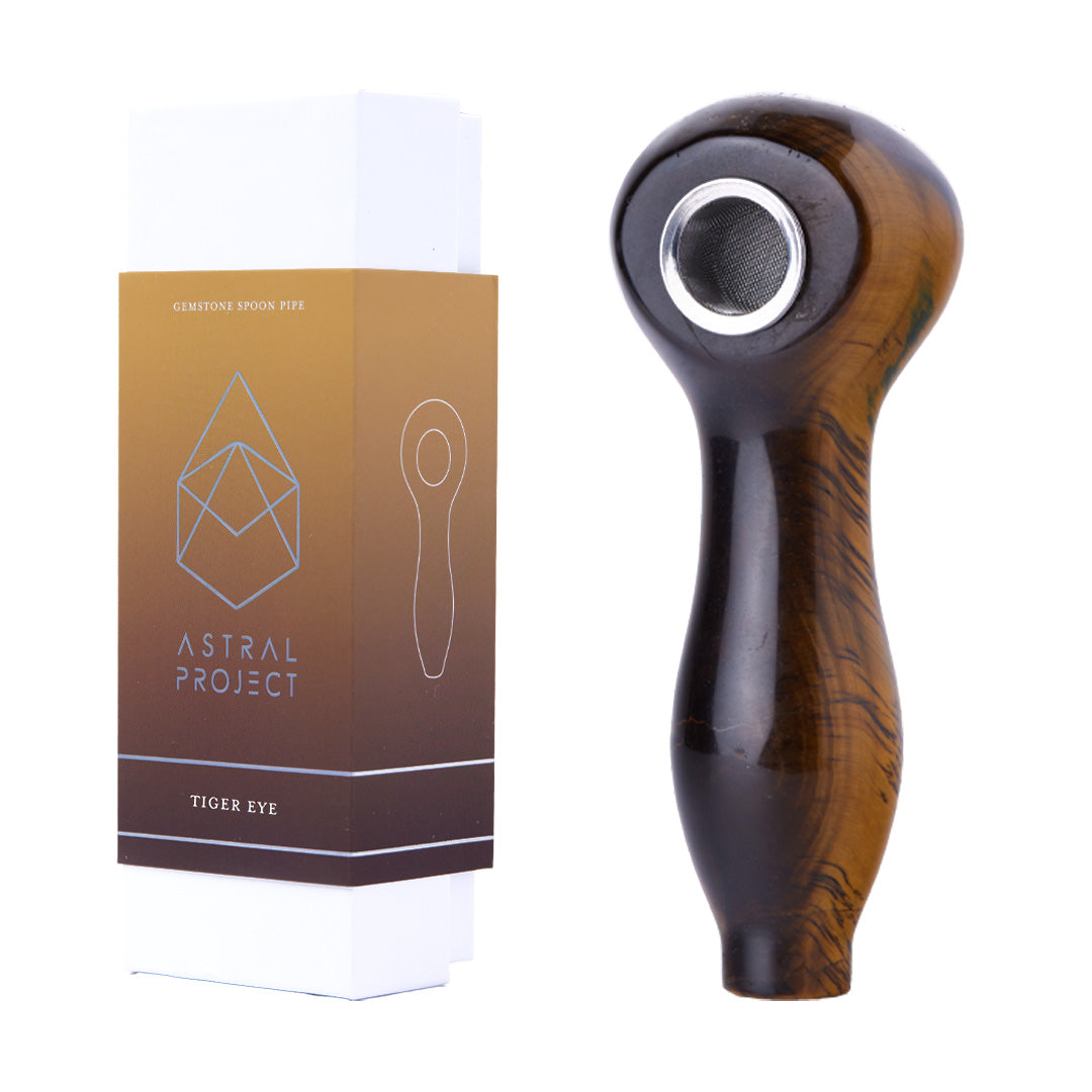 Astral Project Tiger's Eye Gemstone Spoon Pipe next to packaging, side view with deep bowl