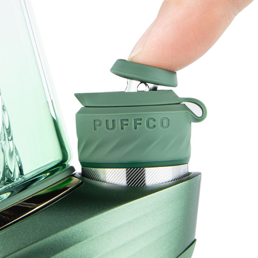 Close-up of Puffco Peak Pro Joystick Cap in Flourish LE, green, being attached to vaporizer