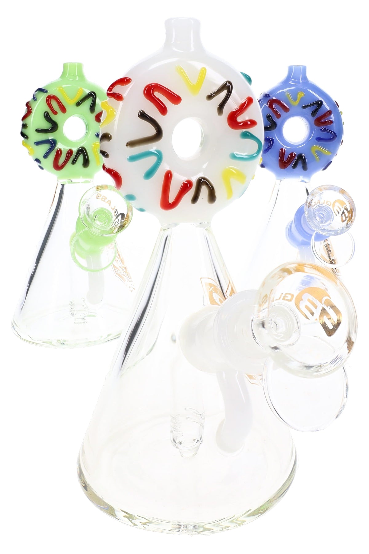 Three 6B Glass donut beaker bongs with white, green, and blue donut mouthpieces covered in raised sprinkles