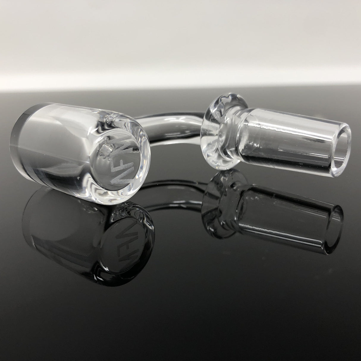 AFM Flat Top Beveled Edge Quartz Banger on reflective surface, clear view of AFM logo