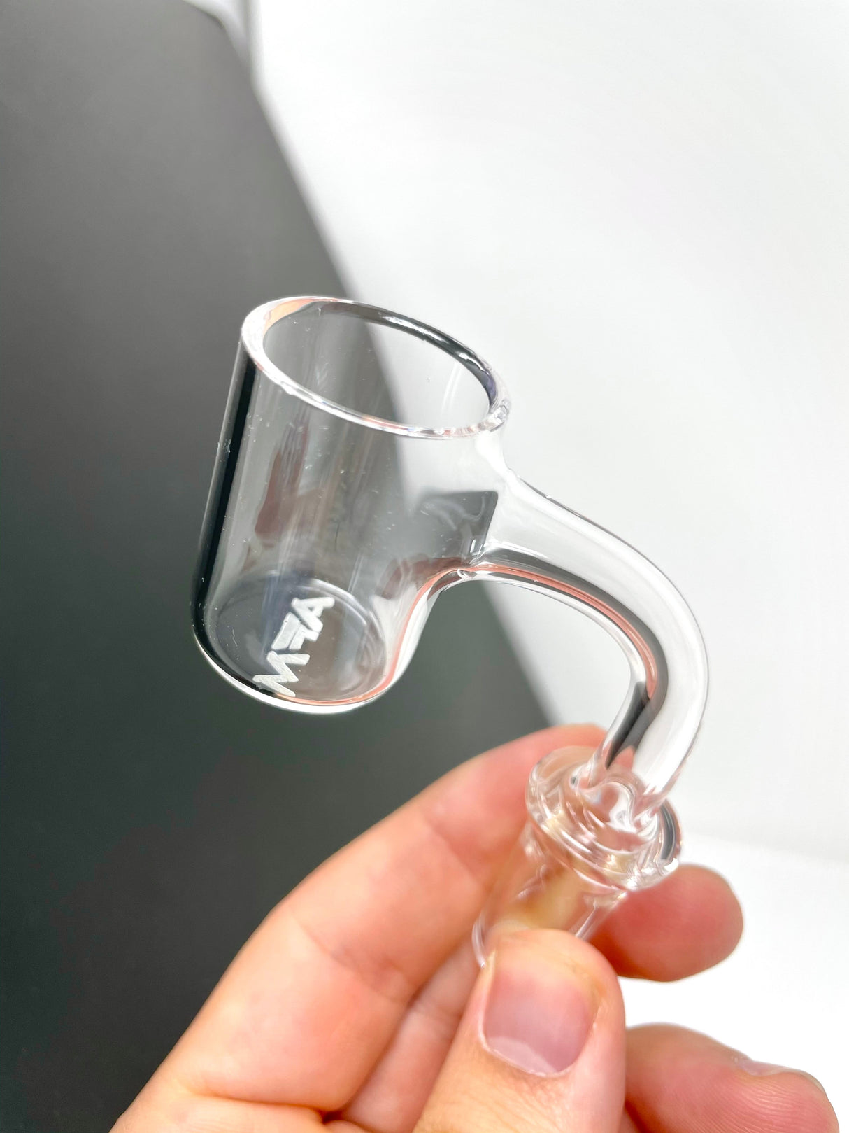 AFM Full Weld Quartz Banger 3mm X 25mm held in hand, clear view on a grey background
