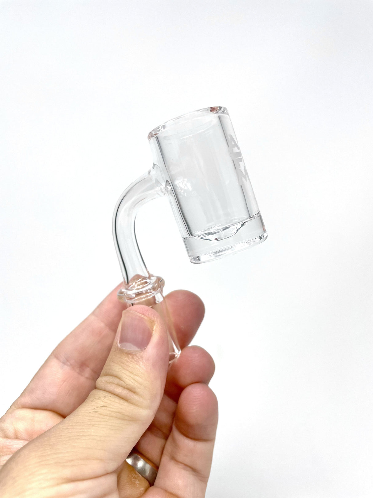 AFM Full Weld Round Bottom Quartz Banger held in hand, clear view of thick 25mm flat top