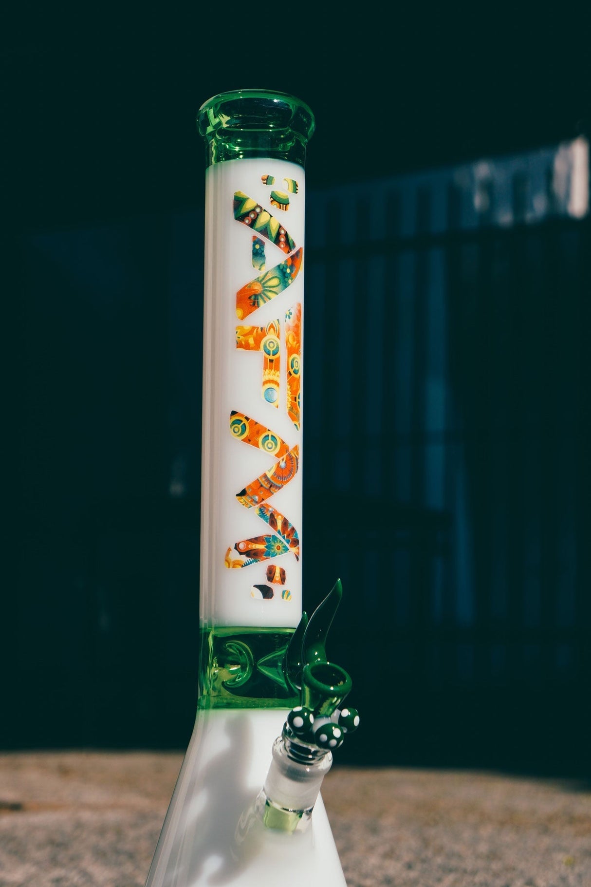 AFM The Karma Beaker Set in clear and green, 18" tall, with intricate designs, side view on white background