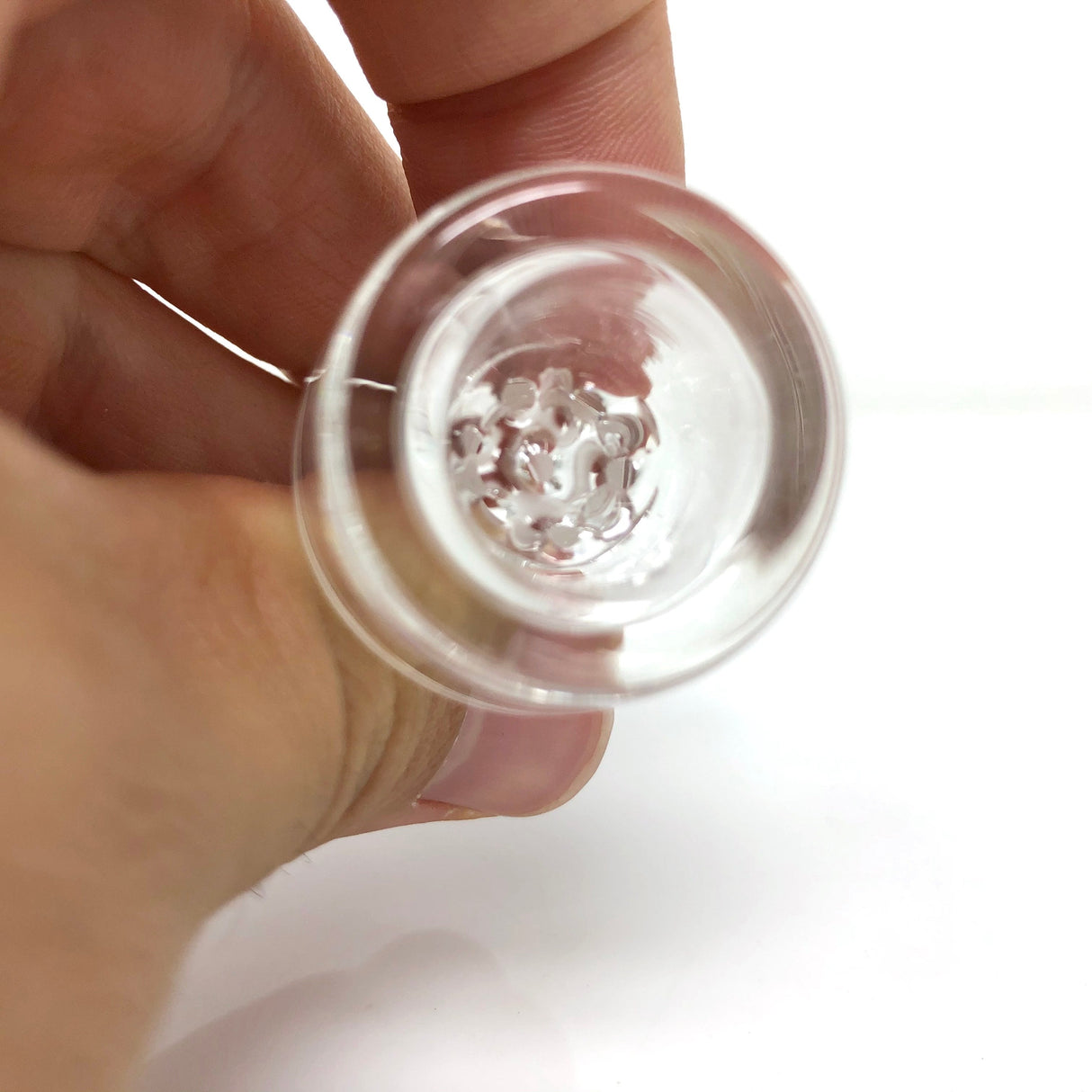 Hand holding AFM The Ultimate Bowl for bongs, clear borosilicate glass, 14mm joint size, top view