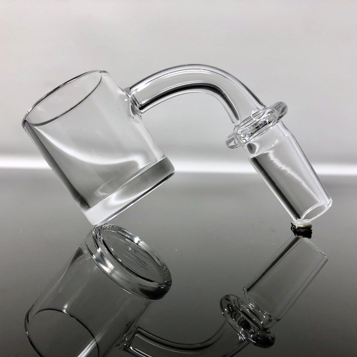 AFM Thick Bottom Quartz Banger Hanger, 2mm x 28mm, Clear, Side View on Reflective Surface