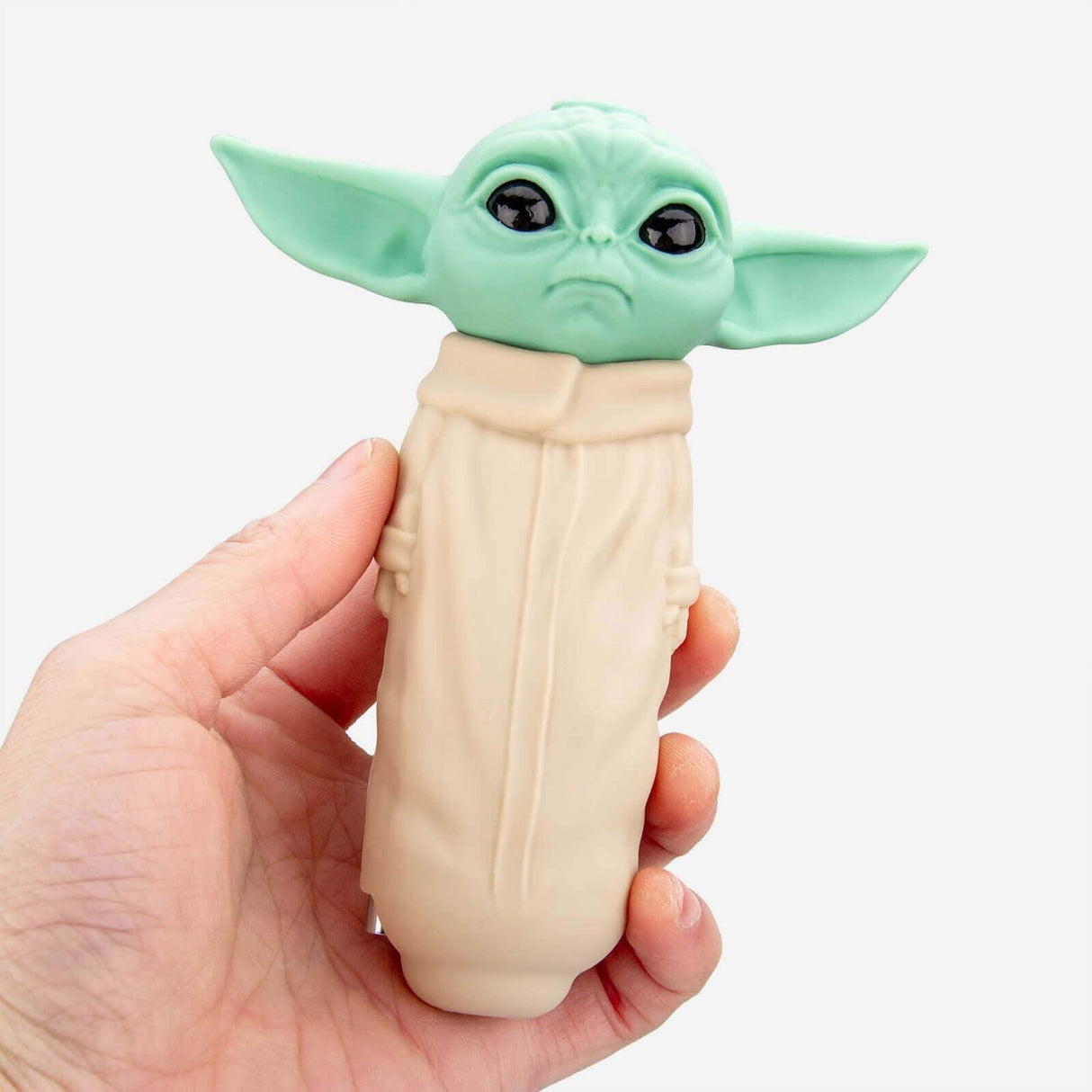 Hand holding Baby Yoda Silicone Hand Pipe by PILOT DIARY, 4.5" for Dry Herbs and Concentrates