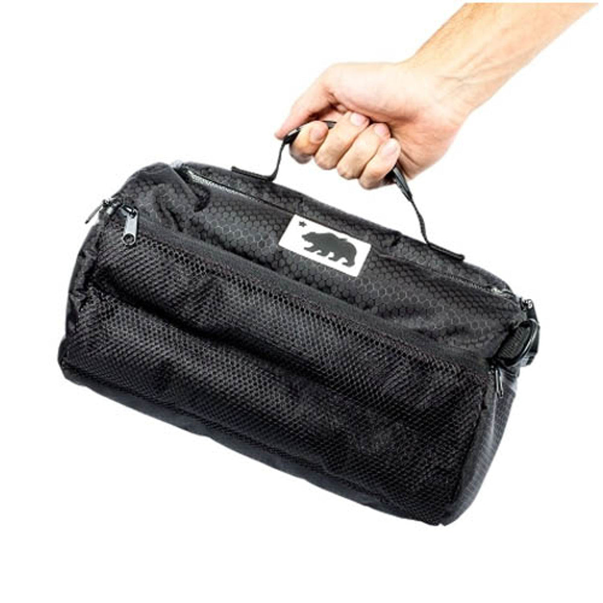 Cali Crusher Cali Duffle 12" Standard - Hand-held angle showing durable black fabric and zipper