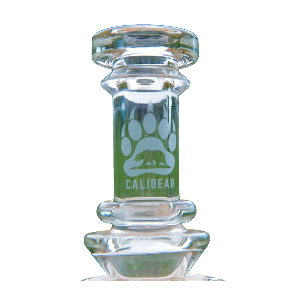 Close-up of Calibear Colored Torus Bong neck with Seed of Life logo on clear glass