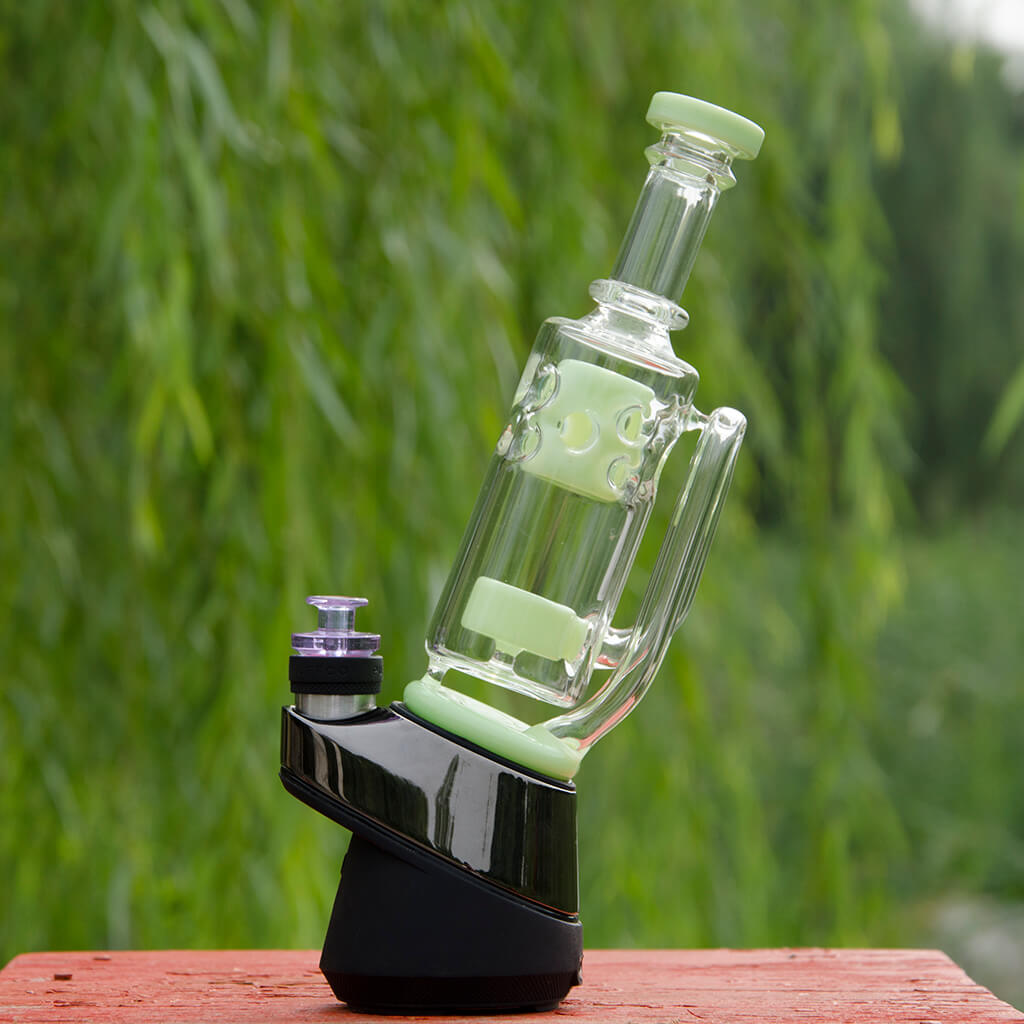 Calibear Straight Fab Puffco Attachment in green, side view on natural background
