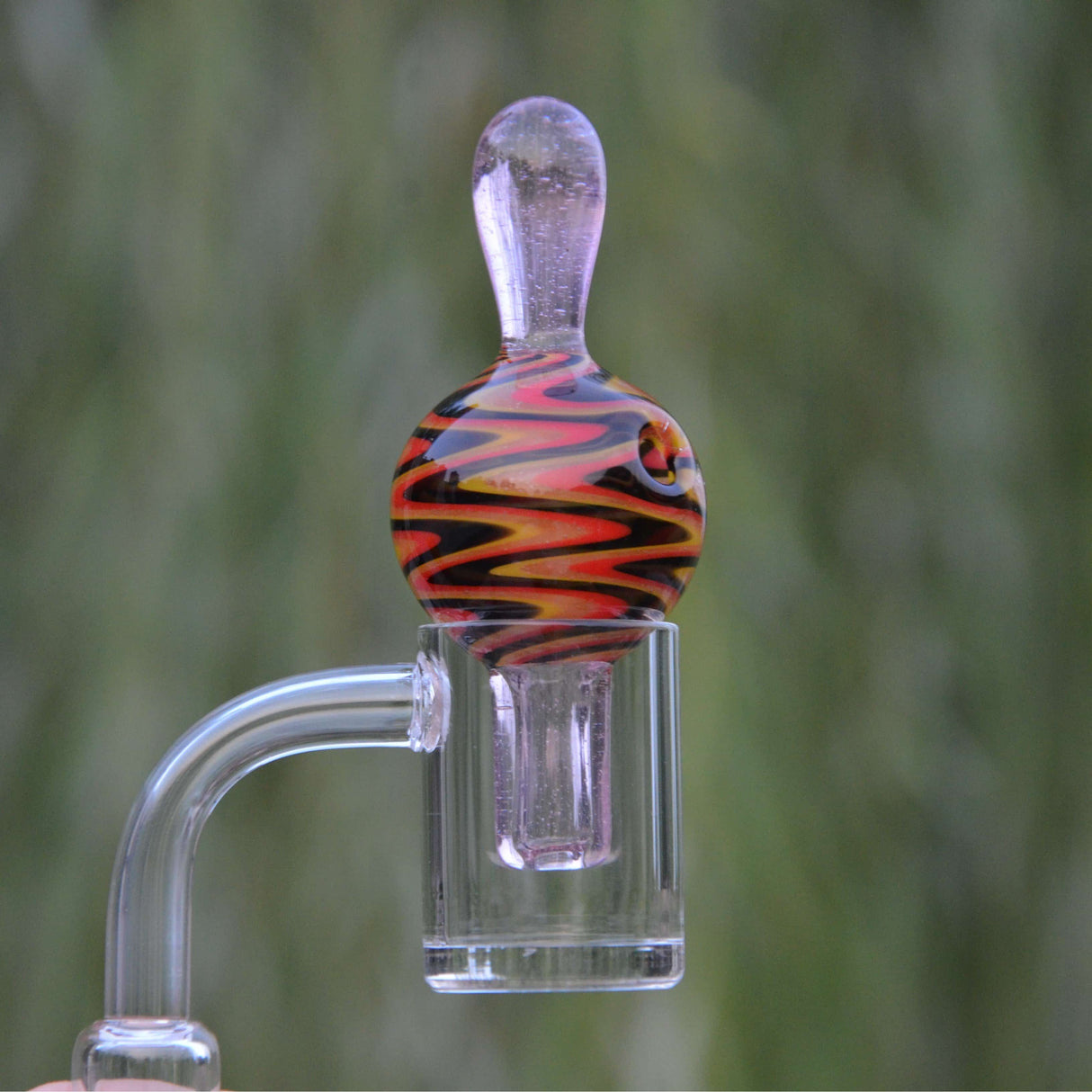 Calibear Wigwag Bubble Carb Cap, high-quality borosilicate glass, vibrant design, close-up view.