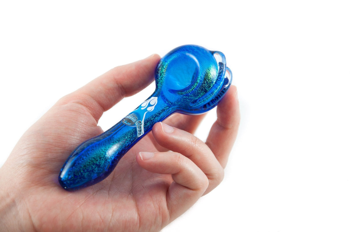 Chameleon Glass Dichroic Prophecy Hand Pipe held in hand, showcasing vibrant blue color and intricate design