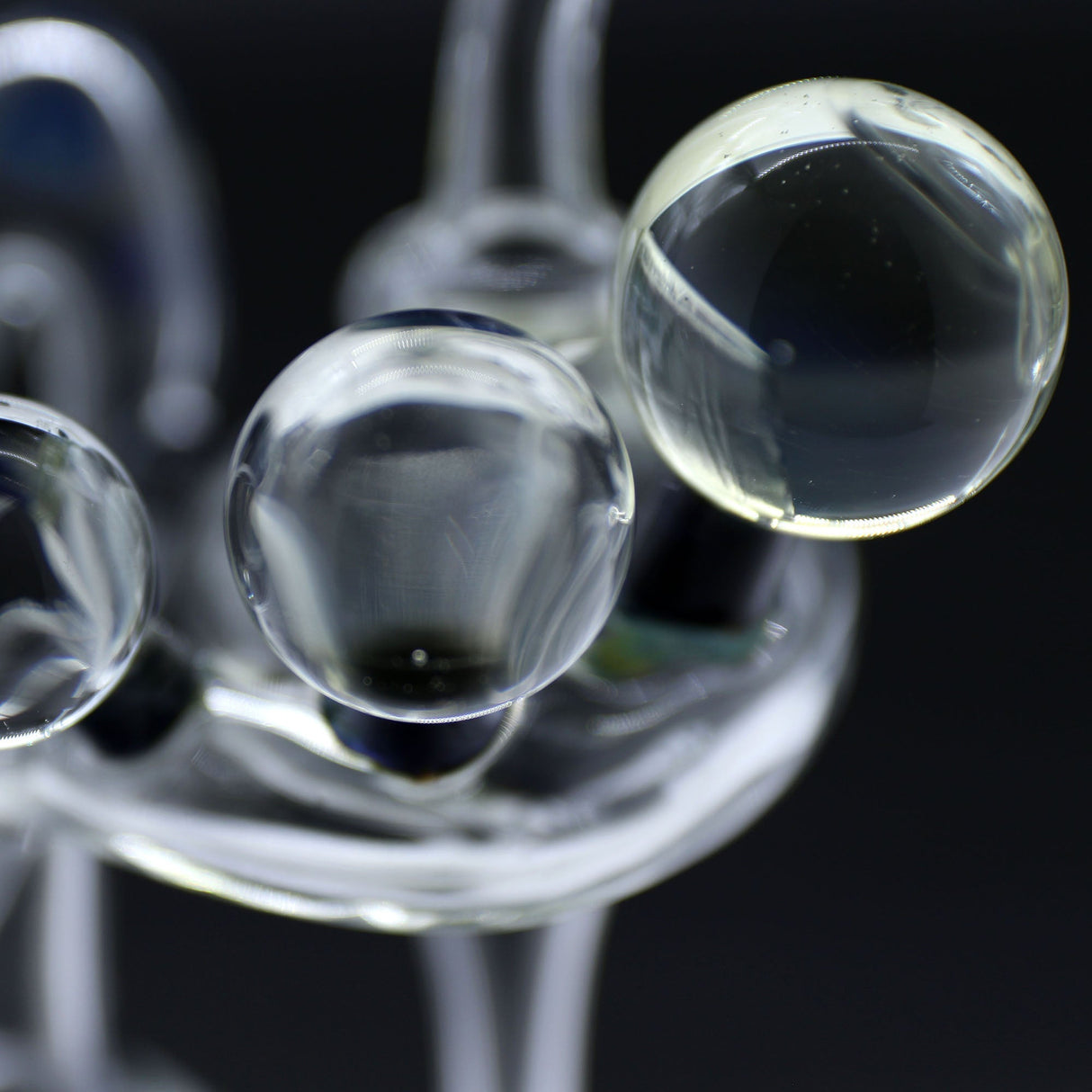 Close-up of Clayball Glass "Milky Way" Heady Recycler Dab-Rig with intricate glasswork