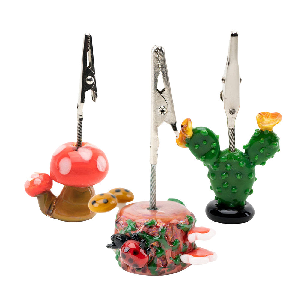 Empire Glassworks themed alligator and mushroom borosilicate glass clips on white background