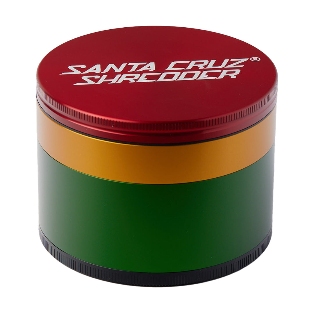 Santa Cruz Shredder Large 4 Piece Grinder in Rasta colors front view on white background