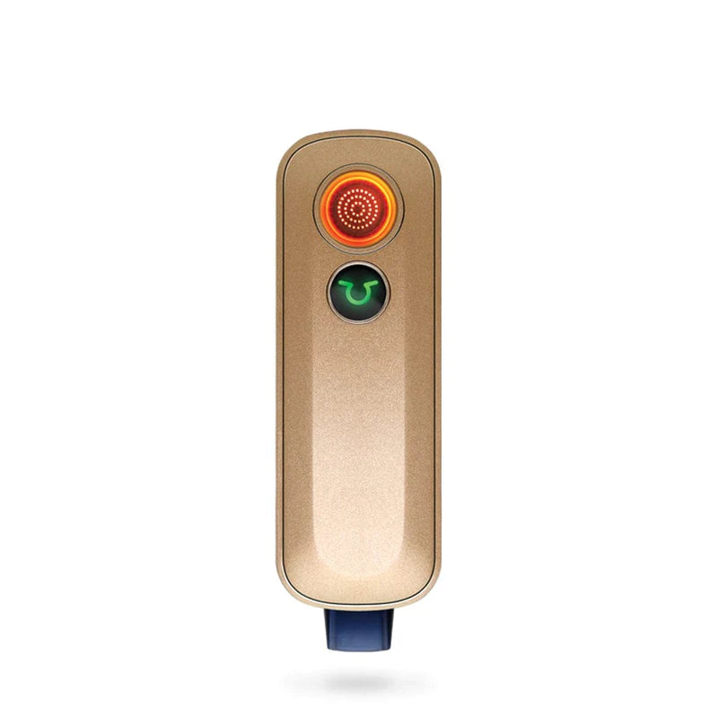 Firefly 2+ Vaporizer in Gold, front view, portable design for dry herbs, with glowing heat indicator