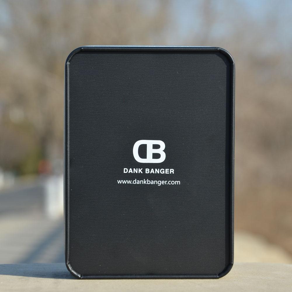 Dank Banger branded packaging for Quartz Hybrid Banger with logo, front view on outdoor setting