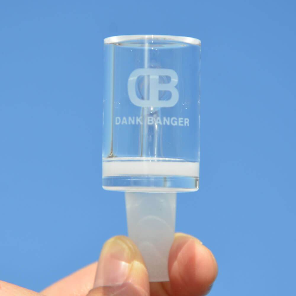 DANK BANGER Hybrid Waffle Banger Set with Spinning Cap, held against blue sky