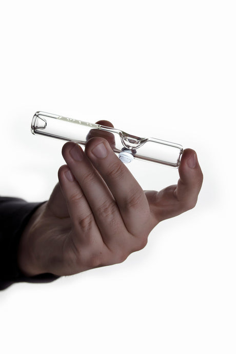 GRAV Mini Steamroller in clear borosilicate glass, compact and portable design, held in hand