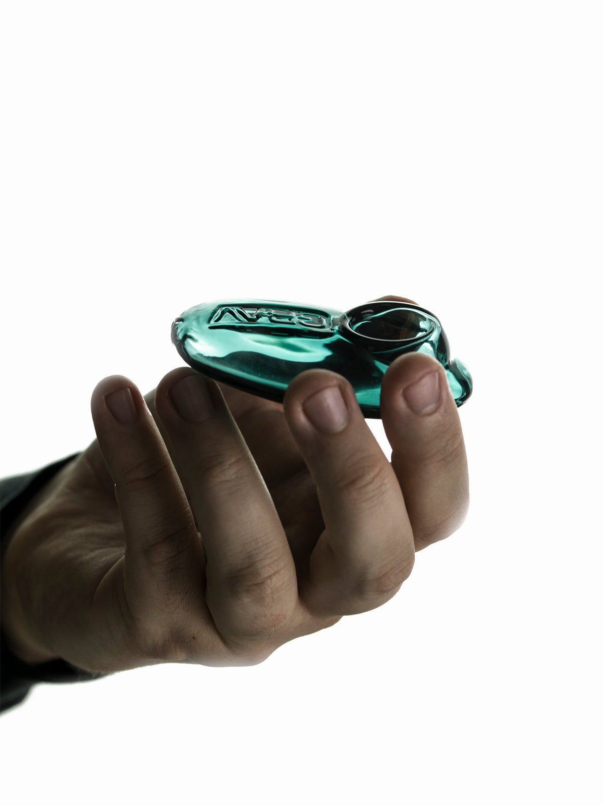 Hand holding GRAV Pebble Spoon Pipe in Amber - Compact Borosilicate Glass, Side View