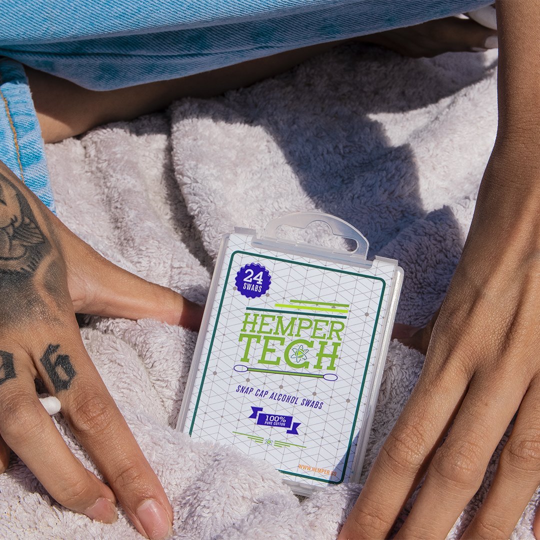 Hemper Tech Snapcap Alcohol Swabs pack held in hand, easy-to-use for cleaning, front view