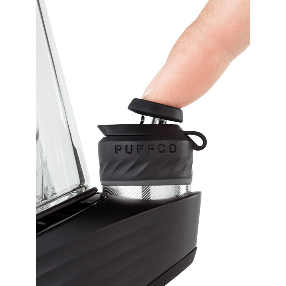 Close-up of Puffco Peak Pro Vaporizer in Black, with a finger lifting the cap, showing portability