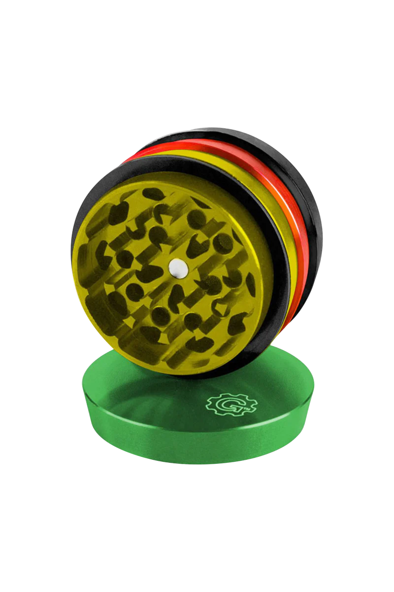 Pulsar 2" Aluminum 4pc Grinder in Rasta colors, top view showing sharp teeth for dry herbs