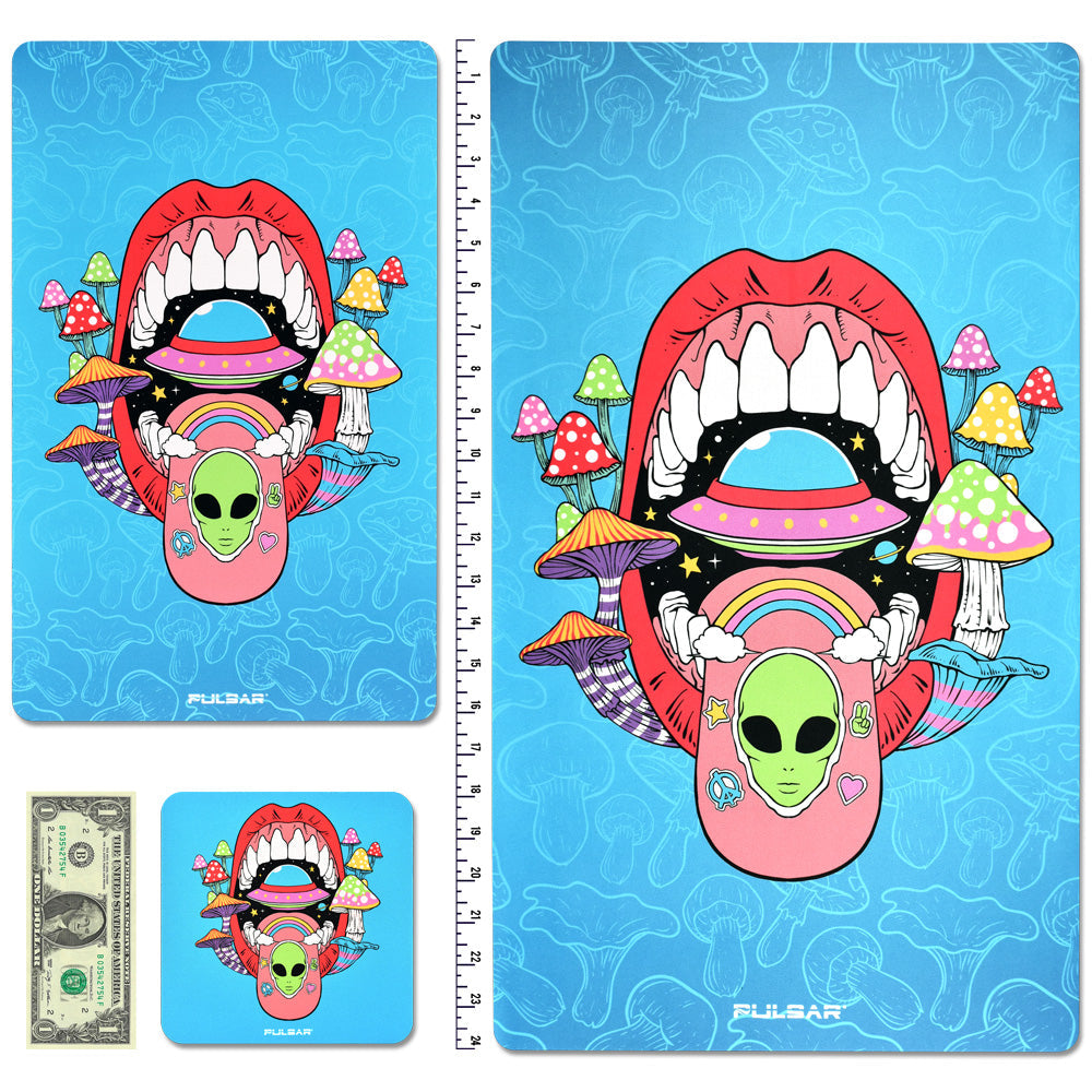 Pulsar DabPadz Fabric Top Dab Mat with vibrant alien and mouth design, next to a ruler and dollar for scale
