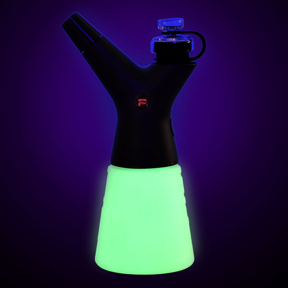 Pulsar RoK Silicone Travel Beaker glowing in dark, front view with storage puck