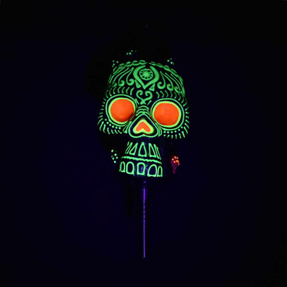 Pulsar Voodoo Skull Vapor Vessel with glowing green and orange design, Ti tip visible, front view